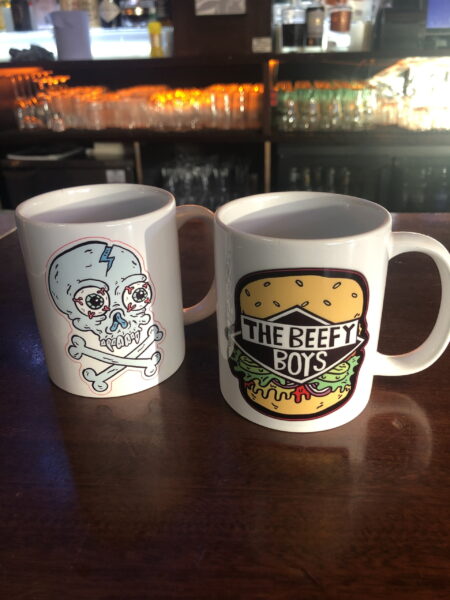 2 x Beefy Boys mugs - one with an illustrated skull, the other with the Beefy Boys logo