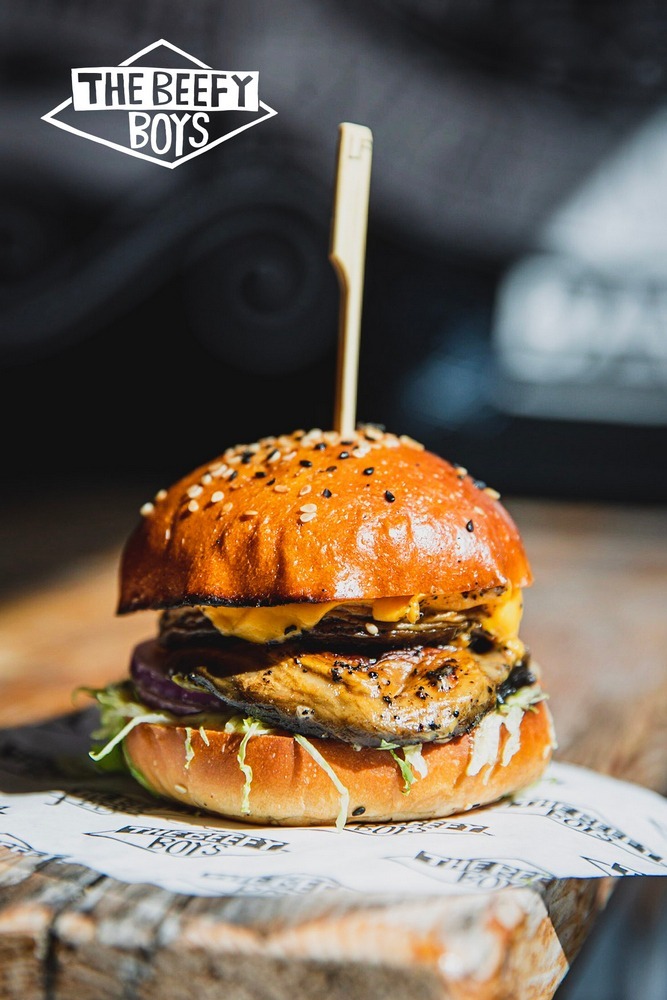 The Leafy Boy features a field mushroom cooked in truffle oil, served with special sauce, American cheese, Swiss cheese, lettuce, onion, and gherkin.
