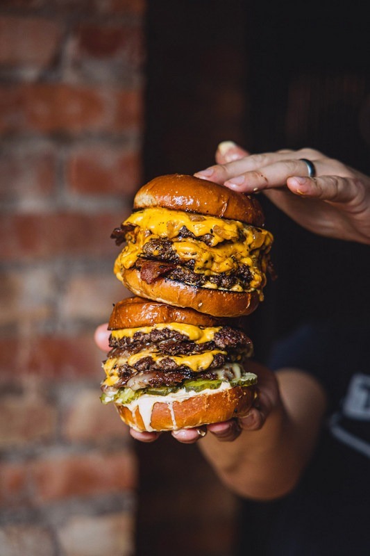 Two juicy burgers stacked up