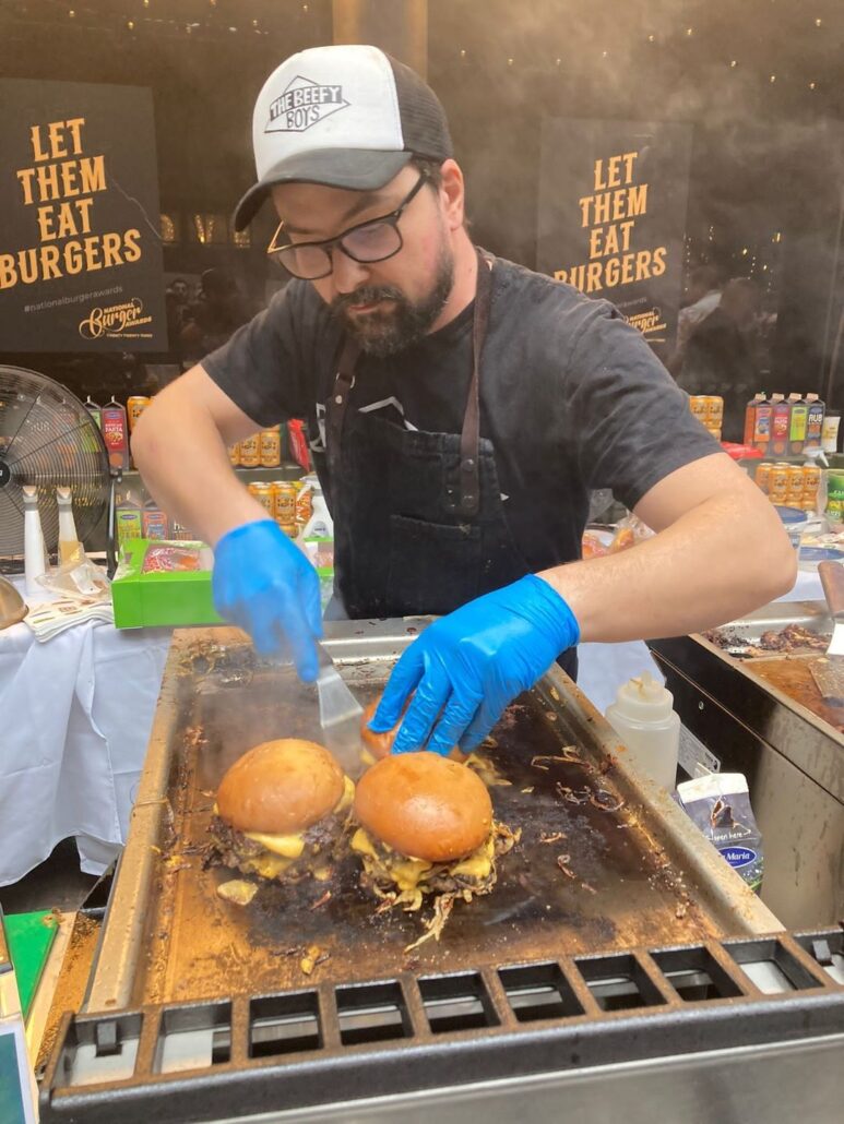 Murf cooking burgers at the National Burger Awards