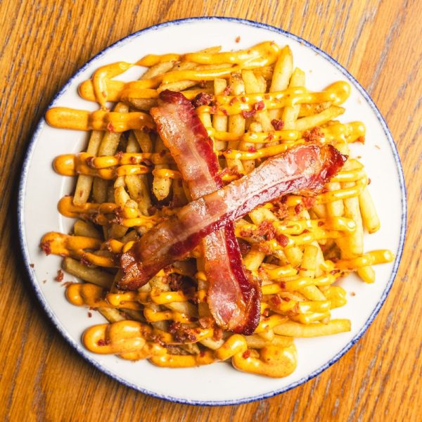 For bacon lovers, our Bacon Fries are a dream come true. Indulge in a generous serving of crispy bacon, complemented by our savory Baconaise and topped with even more bacon bits.