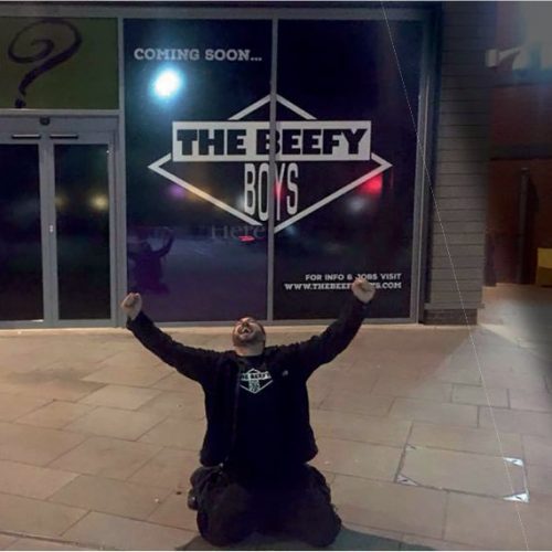 Dan celebrating outside the front of the Hereford branch