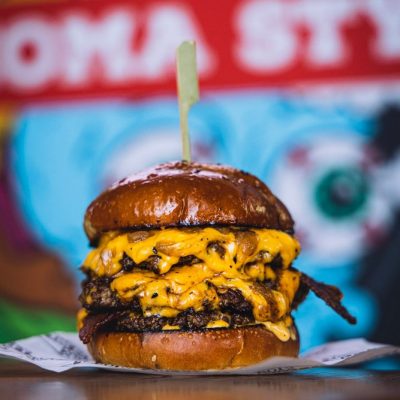 The Dirty Boy boasts a succulent double patty, generously topped with American cheese, Dirty Mayo, beef dripping onions, and crispy bacon.