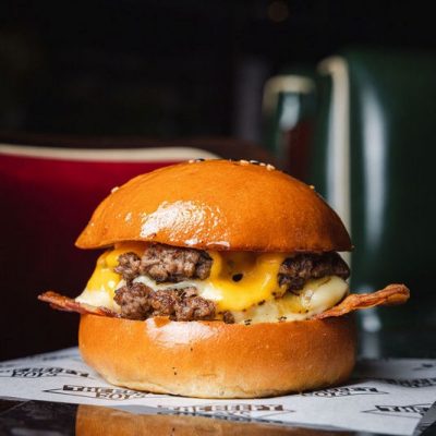 Stripped of extras, it showcases the pure essence of a great burger—just meat, cheese, bacon, and a bun. For those who prefer it even more classic, we offer the Basic Boy with American cheese.