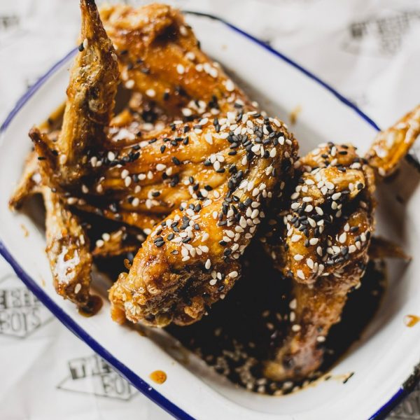 Our Ninja Wings are marinated in a delectable mix of soy, garlic, and honey, finished with a sprinkling of sesame seeds