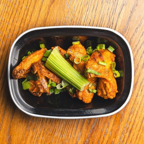 Our tender wings are drenched in spicy buffalo sauce, served with a side of refreshing Blue Cheese Dip, celery sticks, and spring onion.