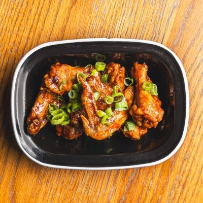 Chicken wings with our special Butty Bach BBQ sauce, then topped with a garnish of fresh spring onion